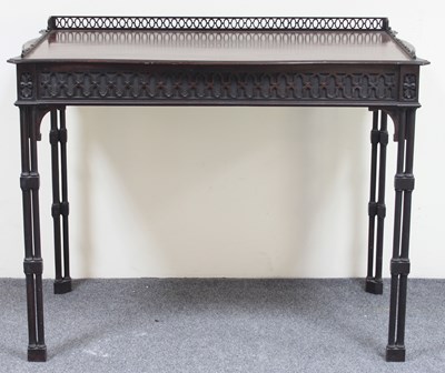 Lot 51 - An Edwardian Chippendale style serpentine...