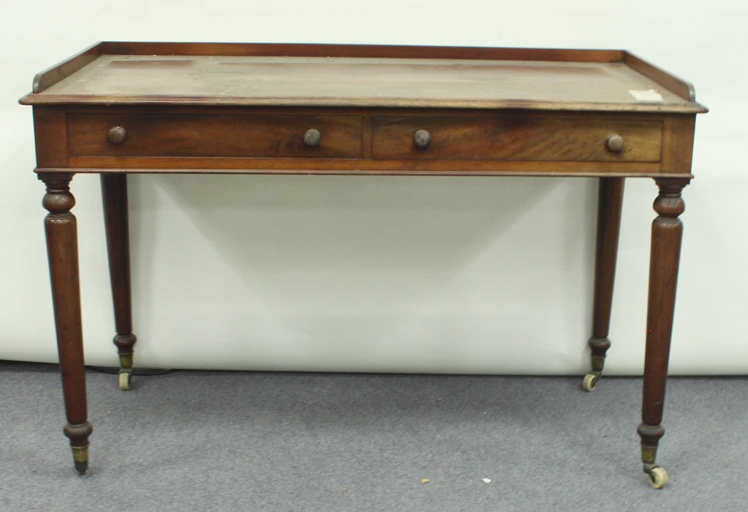 Lot 74 - A mahogany two-drawer dressing table on turned...