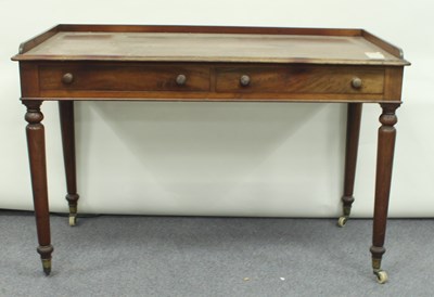 Lot 74 - A mahogany two-drawer dressing table on turned...