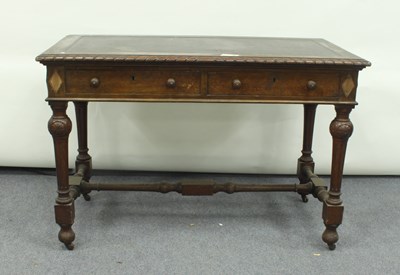 Lot 75 - A Victorian oak two-drawer writing table with...