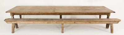 Lot 89 - A pine kitchen table, with three-plank top on...