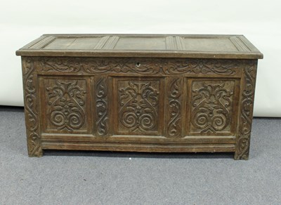 Lot 97 - An oak chest with carved and panelled front,...