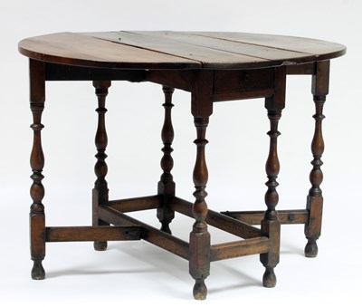 Lot 112 - A 17th Century oak gateleg table of oval form...