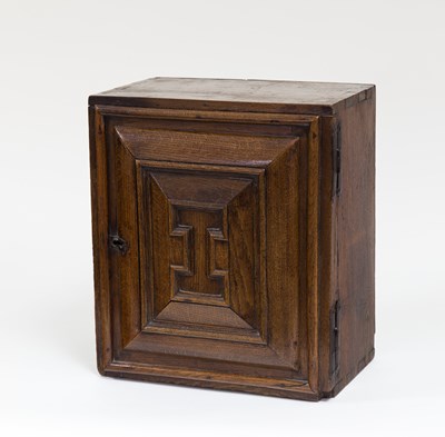 Lot 123 - A fine 17th Century oak spice cupboard, the...