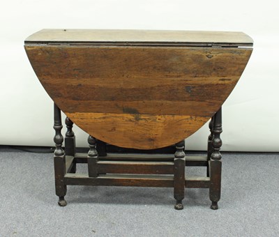 Lot 127 - An oak gateleg table, circa 1700, the oval two-...