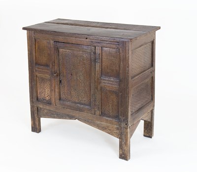 Lot 128 - A 17th Century oak food cupboard with central...