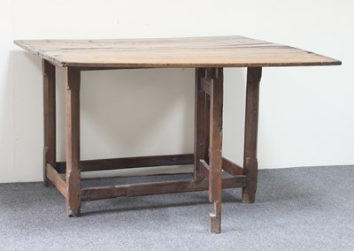 Lot 129 - A fruitwood and oak drop leaf table, circa...