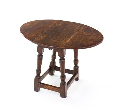 Lot 140 - A 17th Century oak joint stool table, the elm...