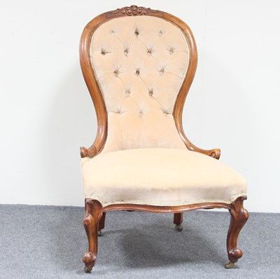 Lot 151 - A Victorian lady's fireside chair, with carved...