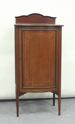 Lot 157 - An Edwardian mahogany bowfront music cabinet,...