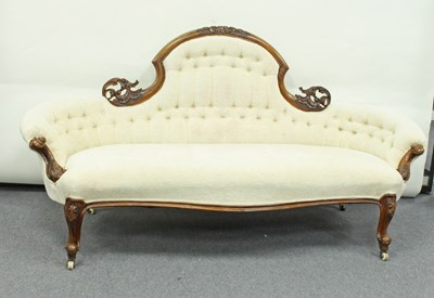 Lot 162 - A Victorian carved walnut framed sofa, the...