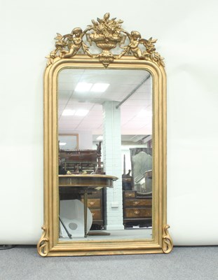 Lot 165 - A gilt framed overmantel mirror, the crest...