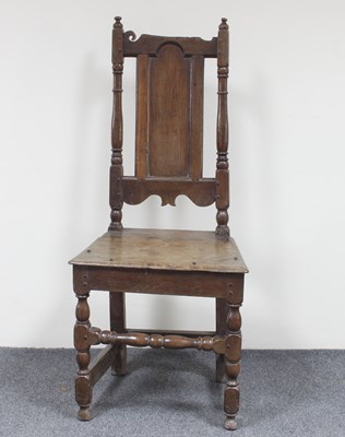 Lot 175 - A late 17th Century oak side chair with scroll...