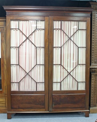 Lot 209 - A late 19th Century mahogany wardrobe/bookcase...