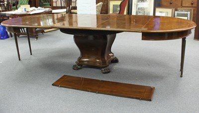 Lot 219 - An Austrian mahogany extending dining table,...