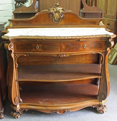 Lot 220 - A walnut buffet with carved back and border...