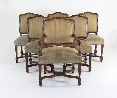 Lot 221 - Twelve walnut dining chairs with moulded...