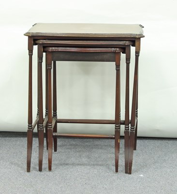 Lot 228 - A nest of three mahogany and inlaid tables,...