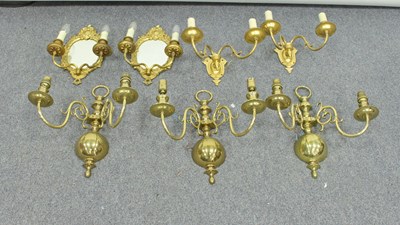 Lot 231 - A pair of gilt metal wall lights, of cartouche...