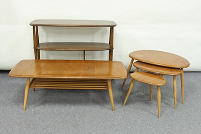 Lot 234 - A nest of three Ercol oval shaped coffee...