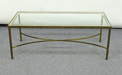 Lot 242 - A brass framed coffee table with plate glass...