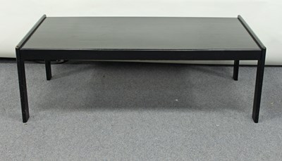 Lot 246 - A rectangular ebonised coffee table on square...