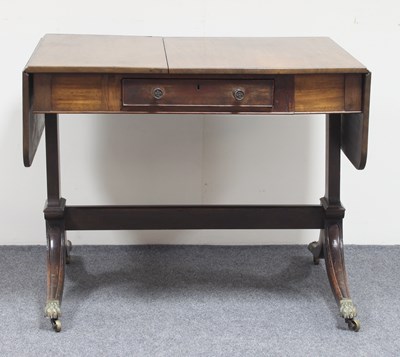 Lot 260 - A Regency mahogany two-flap sofa table with...