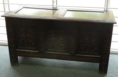 Lot 275 - A 17th Century oak chest with hinged panelled...