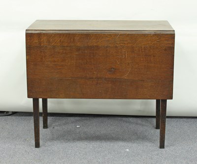 Lot 282 - An oak two-flap table on square taper legs,...