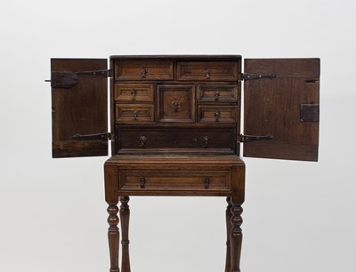 Lot 291 - A 17th Century oak spice cupboard on later...