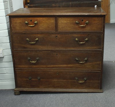 Lot 297 - A George III oak chest of two short over three...