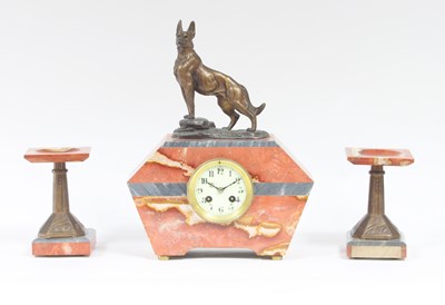 Lot 320 - An Art Deco clock and garniture with spelter...