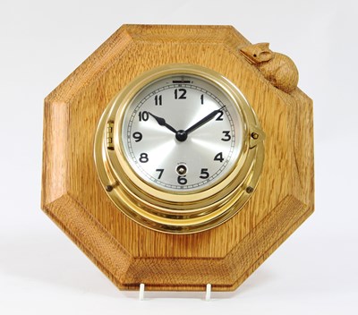 Lot 348 - A Mouseman wall clock, the octagonal board...