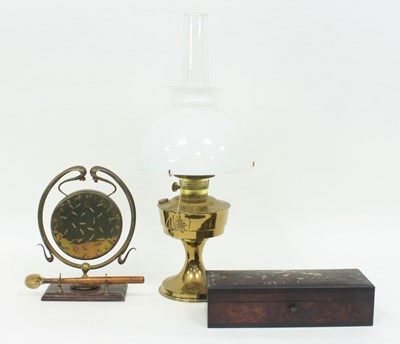 Lot 407 - A brass oil lamp with opaque glass shade and...