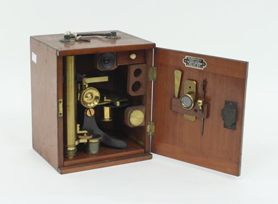 Lot 420 - A microscope, lenses and a few slides, in a...