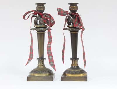 Lot 442 - A pair of gilt brass candlesticks of Empire...