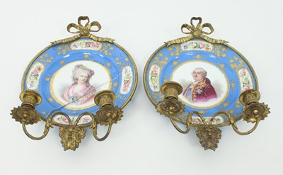 Lot 809 - A pair of Sevres style plates mounted in gilt...