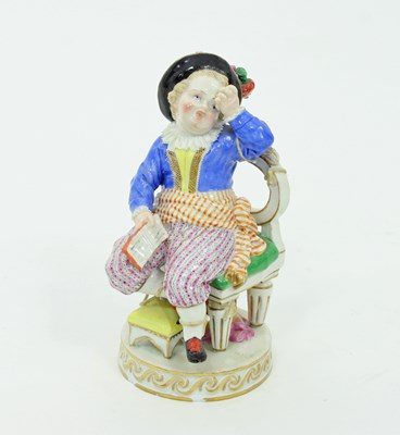 Lot 810 - A Meissen figure of a crying boy, tied to a...