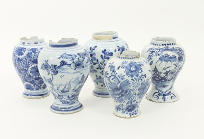 Lot 837 - Five Dutch Delft blue and white baluster vases,...