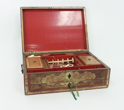 Lot 853 - An Eastern red lacquer work box, highlighted...