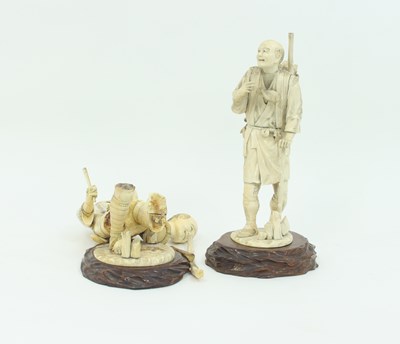 Lot 855 - A pair of Japanese carved and engraved figures,...