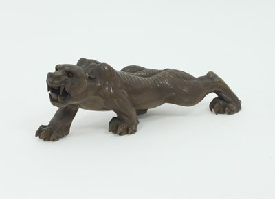 Lot 866 - A Japanese lacquer figure of a tiger,...