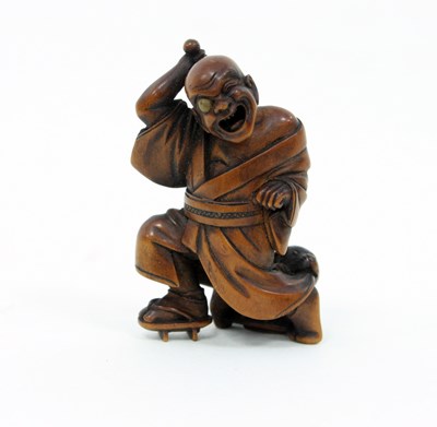 Lot 877 - A Japanese carved boxwood netsuke signed Shoko,...