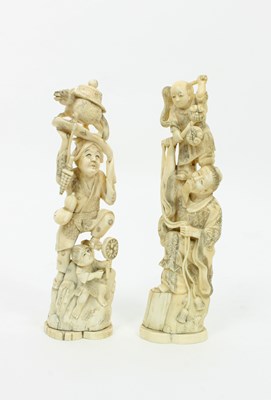 Lot 883 - Two large Japanese ivory okimono, Meiji period,...