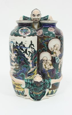 Lot 889 - A Japanese Satsuma double vase, moulded with...