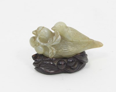 Lot 890 - A jade figure of a bird, a sprig with berries...