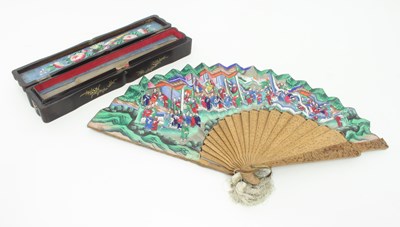 Lot 910 - A Cantonese carved sandalwood and painted fan,...