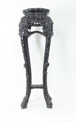 Lot 919 - An Oriental pierced and carved hardwood...