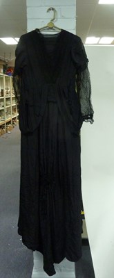 Lot 928 - A black mourning dress and jacket, circa 1880