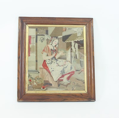 Lot 937 - A needlework picture of a young lady cooking...